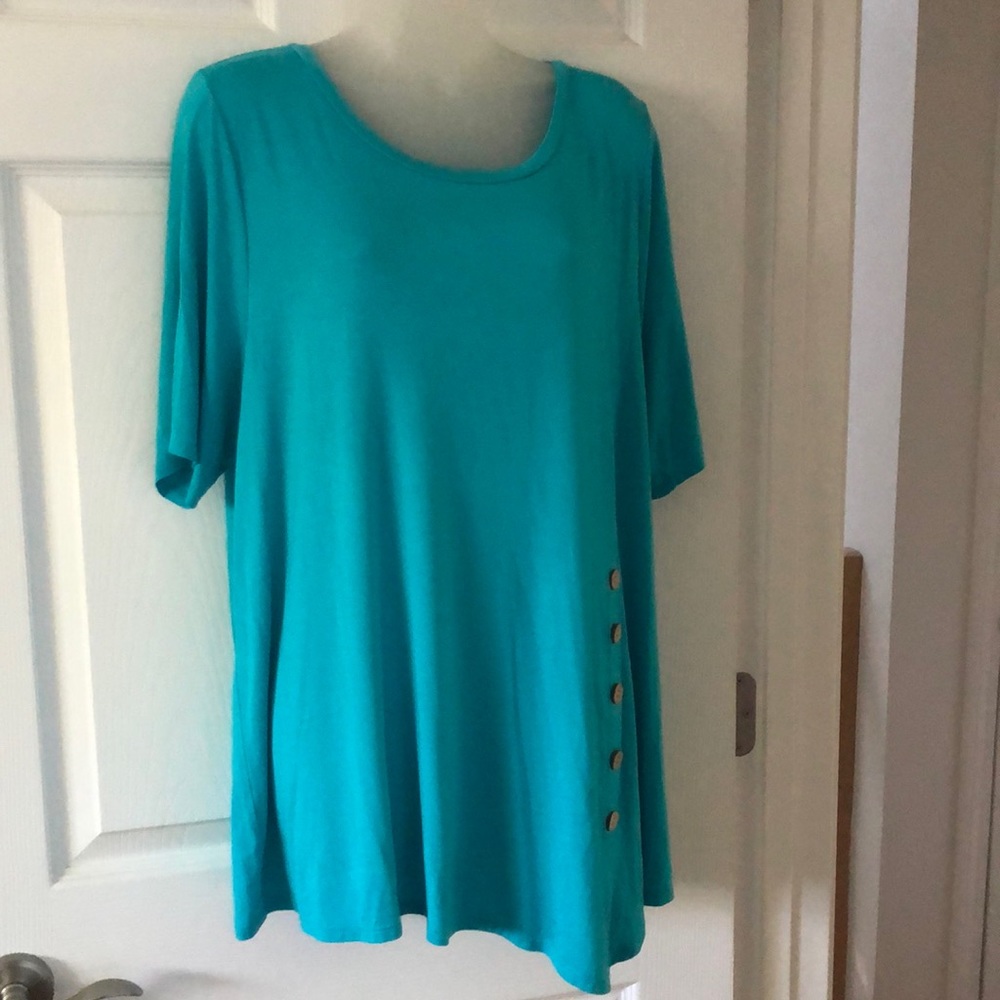 Asymmetrical hem tee with side buttons accent 95% modal, 5% spandex. 1X